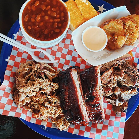 A platter of meats and sides at Real Smoq'ed BBQ