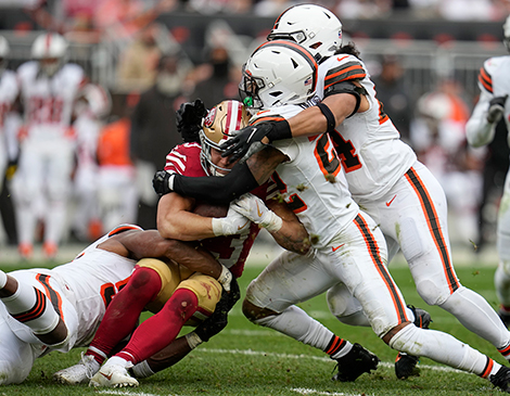 Browns defenders Grant Delpit and Sione Takitai making a tackle