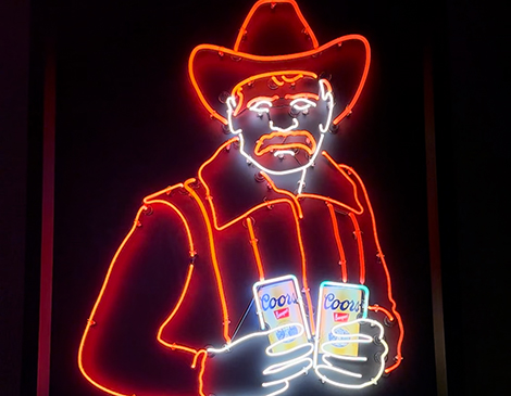 I Hate Cowboy' neon cowboys near the entrance