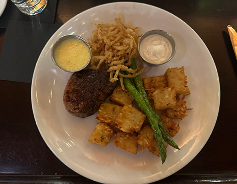One of Cabin Club's steaks and its new tater tots