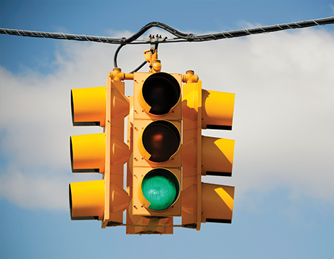 a stop light in a blue sky