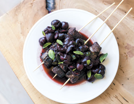 Grilled steak kebabs with macerated Ohio cherries and basil