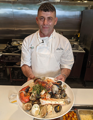 Luca Sema shows off the Mare seafood platter.