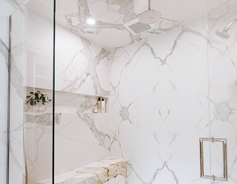 With a mix of dark woods, bright whites and deep blues, this home’s bathroom got a modern uplift while keeping its historical charm in place.