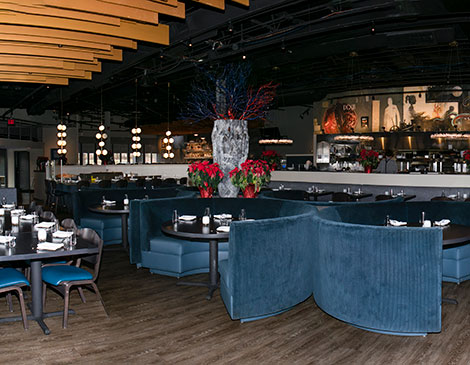 Blu, the Restaurant reinvents the former Moxie spot as a place for  surf-and-turf options, such as the  jumbo diver scallops.