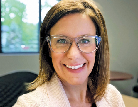 Taryn Chmielowicz smiling in her office