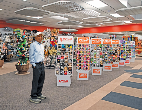 The founder of Wild Republic, G.B. Pillai, standing in a showroom of products