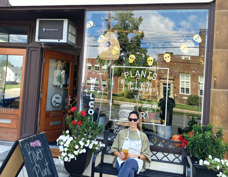 Jennifer Hihn sitting outside of River Plant Co. 