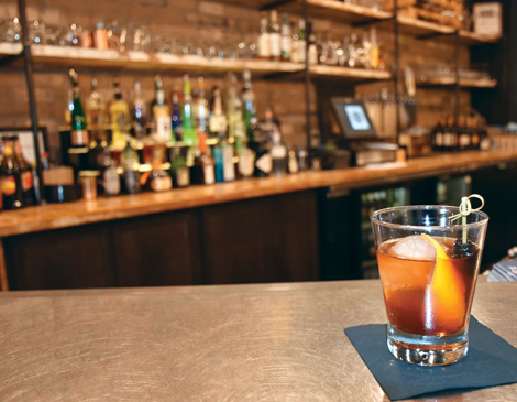 An old fashioned sitting on the bar at 56 Kitchen
